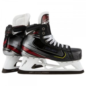 Black, red, and white Bauer ice skates