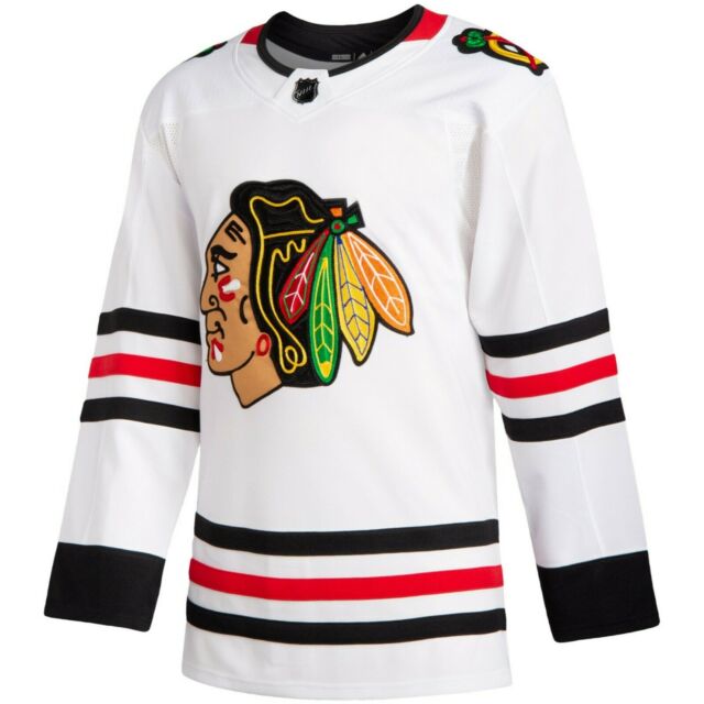The front of a white Chicago Blackhawks Jersey for sale at Gunzo's hockey store in Chicago